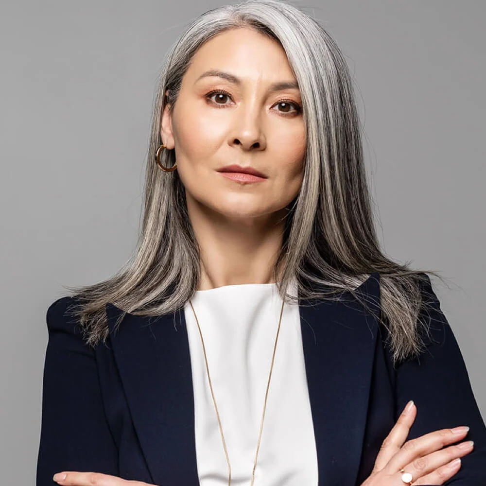 confident-asian-businesswoman-with-grey-hair-and-c-2023-11-27-04-55-11-utc-1.webp